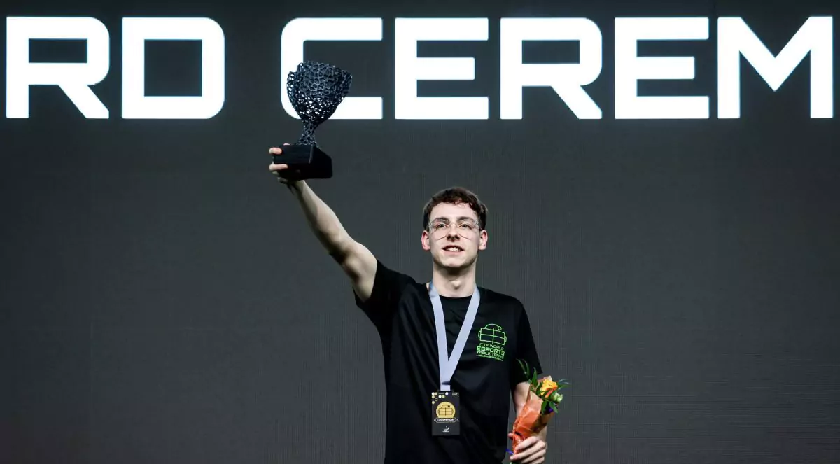 Antonin “Anto” Landreau holding a trophy as a champion of ITTF World Esports Table Tennis Championships