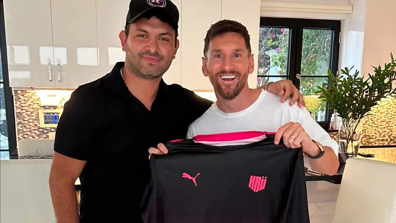 messi holding the tshirt of kru esports